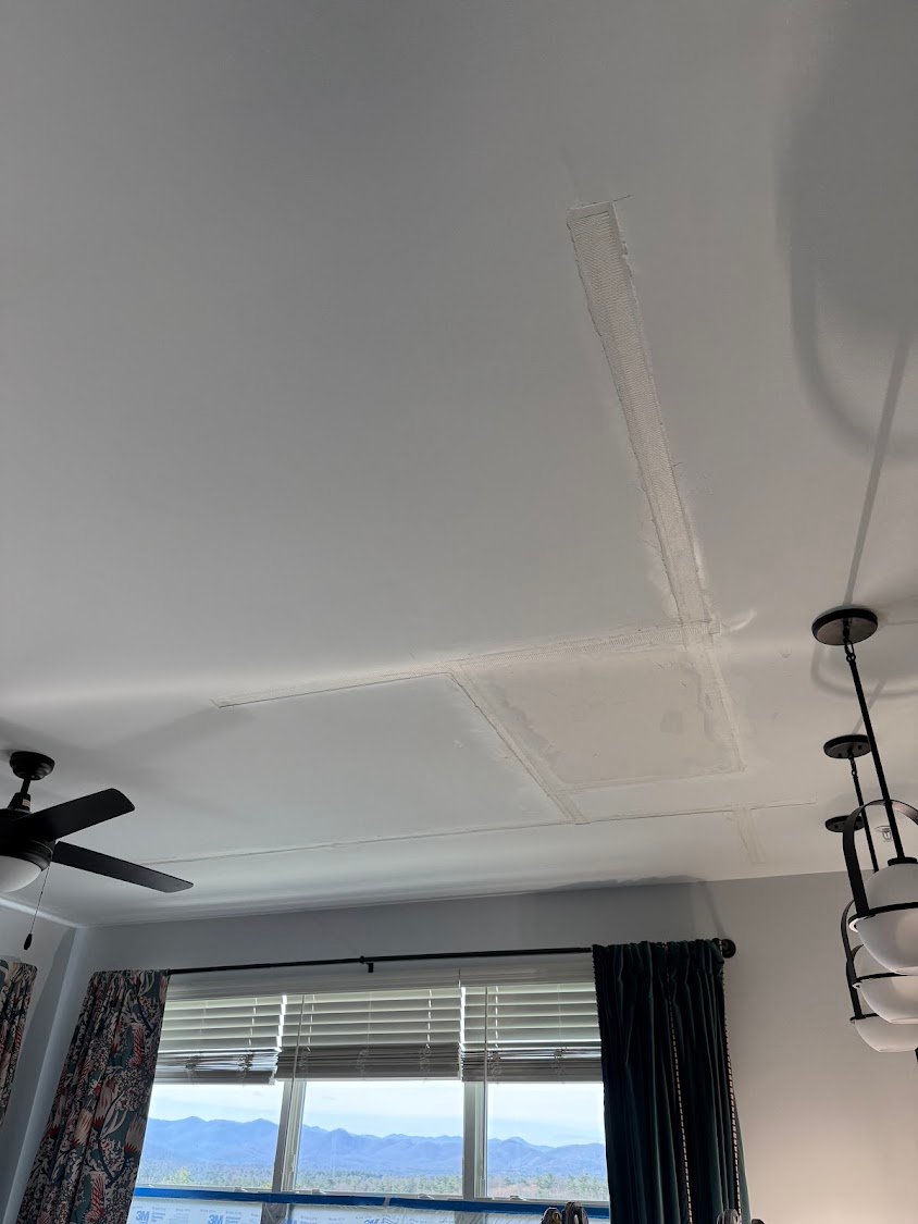 Cracked ceiling before repair