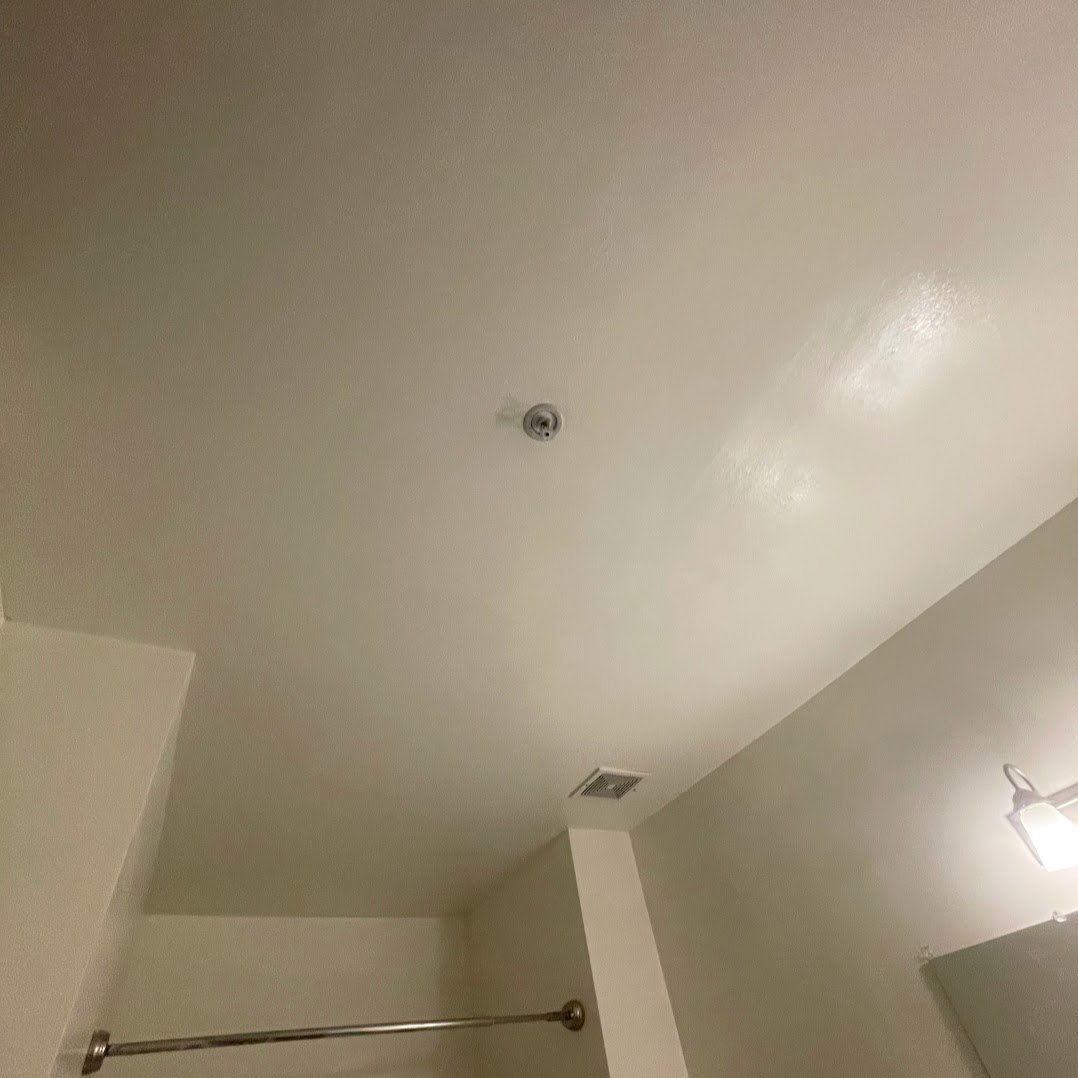 Ceiling after popcorn texture removal, smooth finish