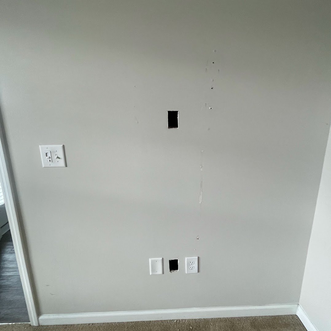 Wall access cut before electrical post-trade repair