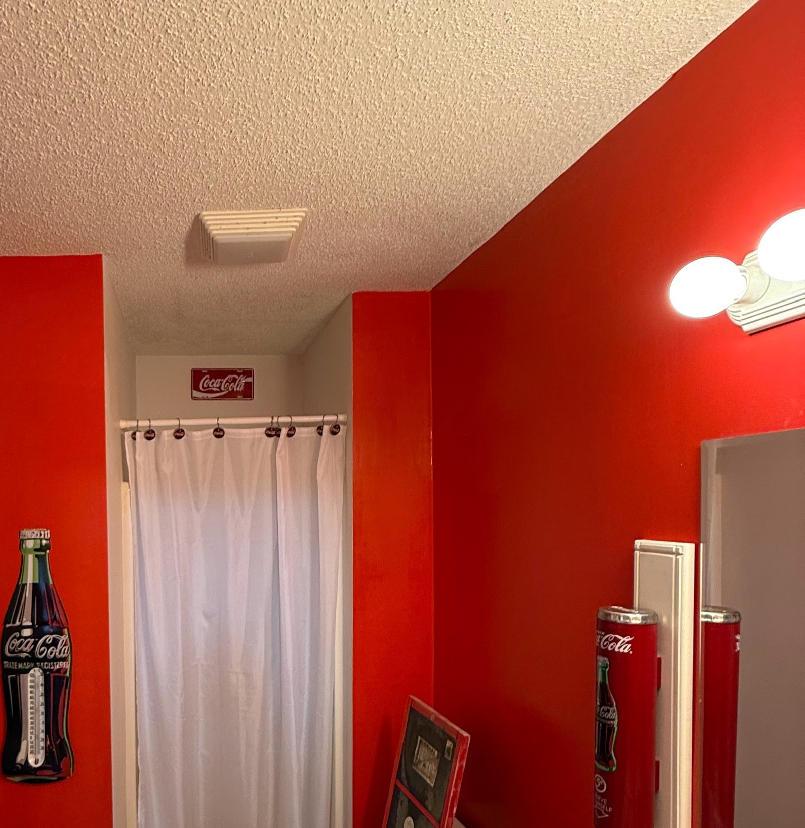 Wall after plumbing post-trade drywall patch, finish-ready