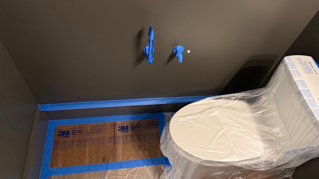 Small drywall nail-pop repair before patching